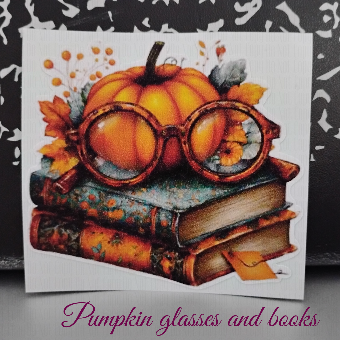 autumn sticker with pumpkin and glasses on vintage book stack