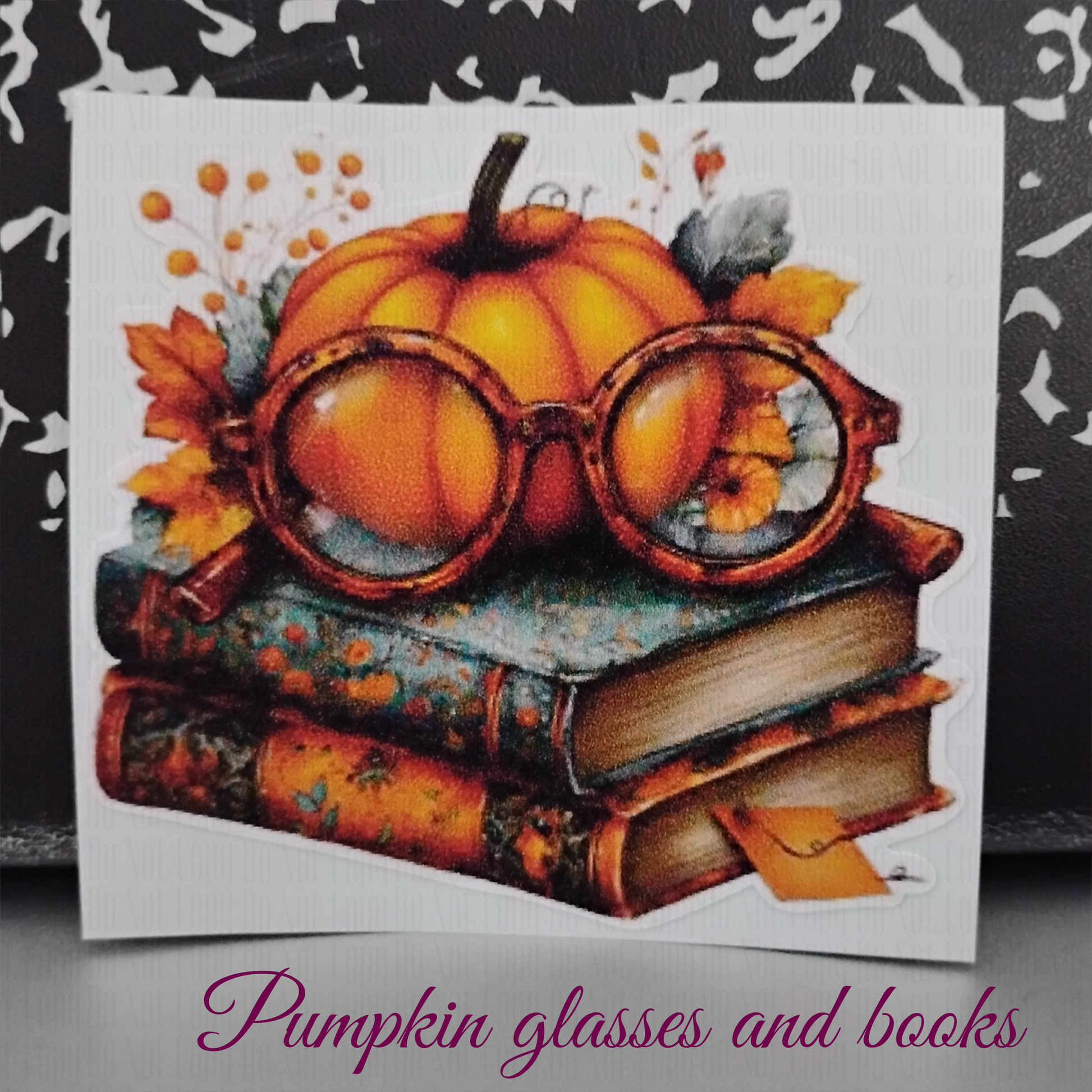 autumn sticker with pumpkin and glasses on vintage book stack